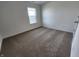 Comfortable bedroom featuring neutral-colored carpet and a bright window at 3202 W Longbranch Dr, Monrovia, IN 46157