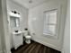 Bright bathroom featuring modern vanity, updated fixtures and a new toilet at 324 N Tacoma Ave, Indianapolis, IN 46201