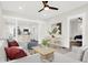 Open-concept living room with modern finishes, flowing into the kitchen and adjacent bedroom at 324 N Tacoma Ave, Indianapolis, IN 46201