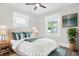 Serene main bedroom featuring a plush bed, ample natural light, and tasteful decor at 324 N Tacoma Ave, Indianapolis, IN 46201