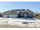 Gray two-story house with white accents and a two-car garage; winter scene at 3725 Maple Ridge Trl, Columbus, IN 47201