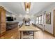 Open concept dining room features a large wooden table and connects to the kitchen and living areas at 1741 Fair Glen Ct, Greenfield, IN 46140