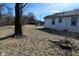 View of the backyard with a detached structure in the background, showcasing the property's outdoor space at 3111 Station St, Indianapolis, IN 46218