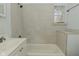 Modest bathroom with a tub-shower combination, window, and classic fixtures at 3111 Station St, Indianapolis, IN 46218