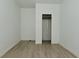 A bedroom with a closet, light-colored walls and modern floors at 3111 Station St, Indianapolis, IN 46218