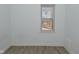 A well-lit bedroom with a window overlooking the yard and sleek floors at 3111 Station St, Indianapolis, IN 46218