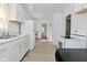 Bright kitchen featuring white appliances, cabinetry, and modern countertops at 3111 Station St, Indianapolis, IN 46218