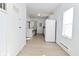 Clean kitchen featuring white appliances, ample counter space, and hardwood flooring at 3111 Station St, Indianapolis, IN 46218