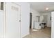 Bright kitchen with white appliances, white countertops, and a laundry area in the background at 3111 Station St, Indianapolis, IN 46218