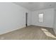 Open living room with neutral walls, updated hardwood flooring, and abundant natural light at 3111 Station St, Indianapolis, IN 46218