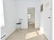 Bright living room with hardwood floors and natural light from a window overlooking the backyard at 3111 Station St, Indianapolis, IN 46218