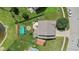 Backyard view of property with pool, fire pit, seating area, shed, and fenced yard at 3335 Hurst St, Whiteland, IN 46184