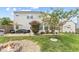 The expansive backyard patio features a seating area, grill, and lovely landscaping at 3335 Hurst St, Whiteland, IN 46184
