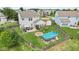 Spacious backyard with pool, fire pit, outdoor seating, shed, and privacy fence at 3335 Hurst St, Whiteland, IN 46184