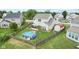 Backyard showcasing fenced in pool, firepit area, seating, and storage shed at 3335 Hurst St, Whiteland, IN 46184