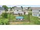 Backyard showcasing fenced in pool, firepit area, seating, and storage shed at 3335 Hurst St, Whiteland, IN 46184