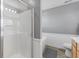 An exquisite glass shower and separate soaking tub create a spa-like experience in this renovated bathroom at 3335 Hurst St, Whiteland, IN 46184