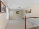 Cozy upstairs landing with plush carpet, perfect as a casual seating area or playroom at 3335 Hurst St, Whiteland, IN 46184