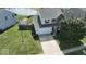 Well-maintained home featuring a two-car garage, spacious driveway, and lush green lawn at 3335 Hurst St, Whiteland, IN 46184