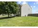 A well-maintained two-story home with a lush green lawn, mature tree, and tidy landscaping showcasing curb appeal at 3335 Hurst St, Whiteland, IN 46184