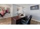 Comfortable home office featuring a large wooden desk, neutral walls, and a view into the home at 3335 Hurst St, Whiteland, IN 46184