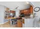Stylish kitchen showcasing stainless steel appliances, wooden cabinetry, and a functional kitchen island at 3335 Hurst St, Whiteland, IN 46184