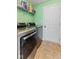 Well-equipped laundry room featuring modern washer and dryer set, with shelving for organized storage at 3335 Hurst St, Whiteland, IN 46184