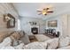 Spacious living room showcasing a fireplace, large sectional couch, and a wood accent wall at 3335 Hurst St, Whiteland, IN 46184
