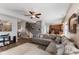 Open-concept living room featuring a fireplace, plush seating, and seamless flow to the kitchen at 3335 Hurst St, Whiteland, IN 46184