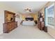 The roomy primary bedroom has plush carpet and neutral paint and is illuminated by natural light at 3335 Hurst St, Whiteland, IN 46184