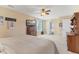 Spacious primary bedroom with a ceiling fan, carpet flooring, TV, and ensuite access at 3335 Hurst St, Whiteland, IN 46184