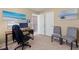 Well-lit home office with a desk, chairs, and stylish decor; perfect for working remotely at 3335 Hurst St, Whiteland, IN 46184