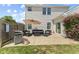 A cozy patio features outdoor seating, grill, and vibrant flowering plants, perfect for entertaining and relaxing outdoors at 3335 Hurst St, Whiteland, IN 46184
