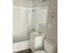 Bathroom with tub-shower, white vanity, and toilet at 712 Lonsvale Dr, Anderson, IN 46013