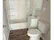 Bathroom with tub-shower, white vanity, and toilet at 712 Lonsvale Dr, Anderson, IN 46013