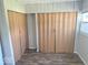 Bedroom with paneled closet doors and new floors at 712 Lonsvale Dr, Anderson, IN 46013