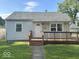 Charming single-story home with a quaint front porch and well-maintained lawn at 712 Lonsvale Dr, Anderson, IN 46013