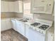 Bright kitchen features white cabinets, laminate countertops, and modern appliances at 712 Lonsvale Dr, Anderson, IN 46013