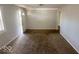 Spacious living area with carpet flooring, freshly painted walls, and ample natural lighting at 712 Lonsvale Dr, Anderson, IN 46013