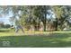 Community playground featuring swings and a slide, perfect for Gathering fun at 712 Lonsvale Dr, Anderson, IN 46013