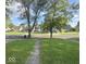 Picturesque street view showcasing a well-manicured lawn and a welcoming neighborhood setting at 712 Lonsvale Dr, Anderson, IN 46013