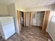 Functional utility area with shelving, and appliances, providing storage and convenience at 712 Lonsvale Dr, Anderson, IN 46013