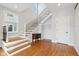 Elegant staircase with wrought iron railing and hardwood floors at 140 W 44Th St, Indianapolis, IN 46208