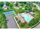 Aerial view of community amenities including a swimming pool, tennis courts, a basketball court, and a playground at 14626 Warner Trl, Westfield, IN 46074