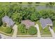Aerial view of the home showcasing its well-manicured lawn, mature trees, and proximity to a pond at 14626 Warner Trl, Westfield, IN 46074