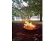 Backyard featuring a fire pit with a view of the lake and sunset at 14626 Warner Trl, Westfield, IN 46074