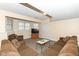 Finished basement with beige carpet, large sectional, tv, and a door leading to another room at 14626 Warner Trl, Westfield, IN 46074