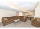 Finished basement with a brown sectional sofa and games, perfect for entertaining and relaxation at 14626 Warner Trl, Westfield, IN 46074