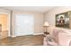 Comfortable bedroom with a pink chair and a framed picture on the wall, complemented by wood flooring at 14626 Warner Trl, Westfield, IN 46074