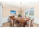 Formal dining room featuring wood table set for six and traditional-style chandelier lighting at 14626 Warner Trl, Westfield, IN 46074